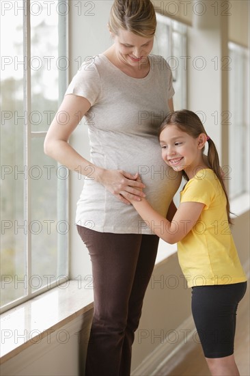 Pregnant woman with daughter (6-7). Photo: Rob Lewine
