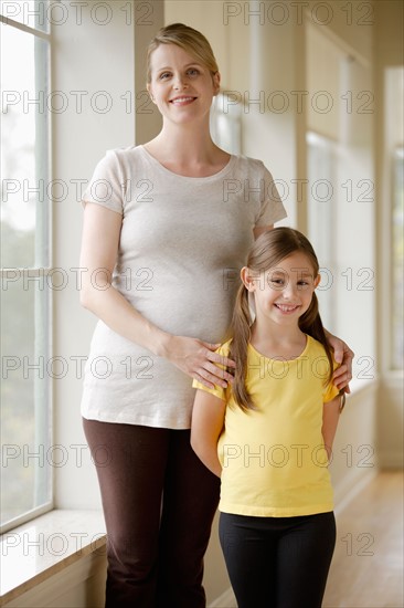 Pregnant woman with daughter (6-7). Photo: Rob Lewine