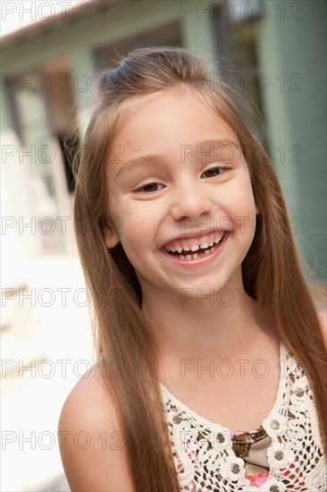 Portrait of cheerful girl (6-7). Photo : Rob Lewine