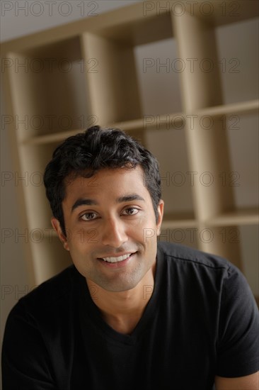 Portrait of young businessman, studio shot. Photo : Rob Lewine