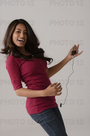 Portrait of young woman, studio shot. Photo: Rob Lewine