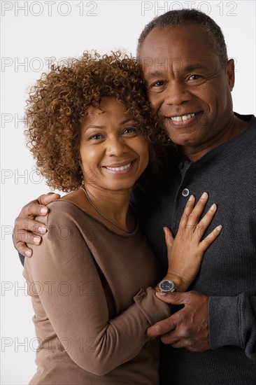 Portrait of mature couple, studio shot. Photo : Rob Lewine