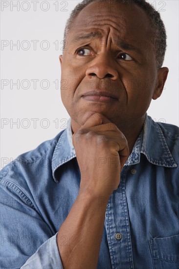 Portrait of mature man, studio shot. Photo: Rob Lewine