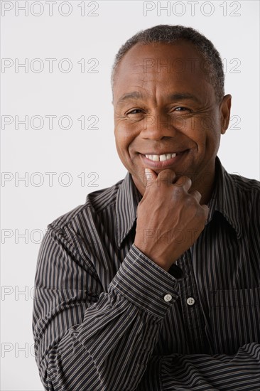 Portrait of mature man, studio shot. Photo: Rob Lewine