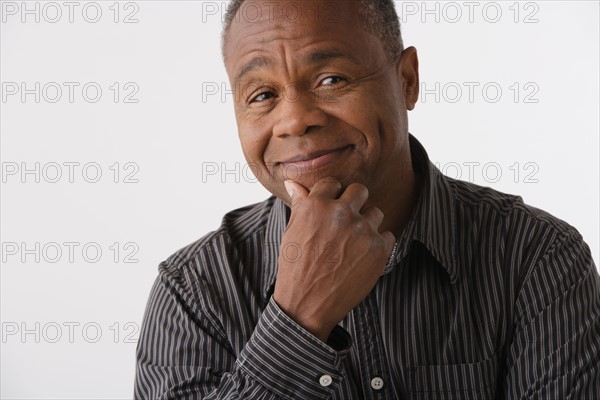 Portrait of mature man, studio shot. Photo: Rob Lewine