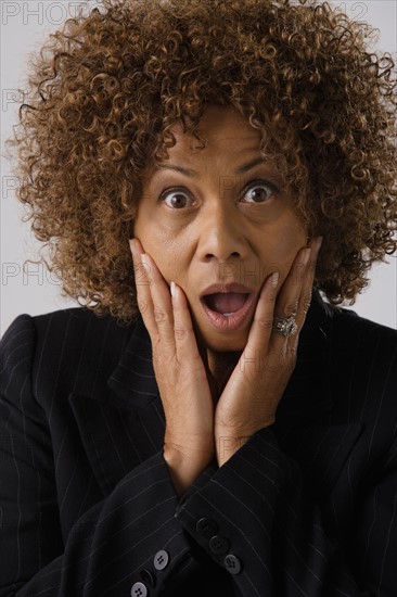 Portrait of mature businesswoman, studio shot. Photo : Rob Lewine