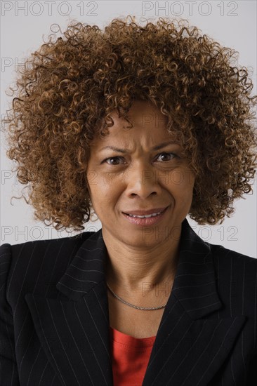 Portrait of mature businesswoman, studio shot. Photo : Rob Lewine