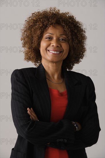 Portrait of mature businesswoman, studio shot. Photo: Rob Lewine