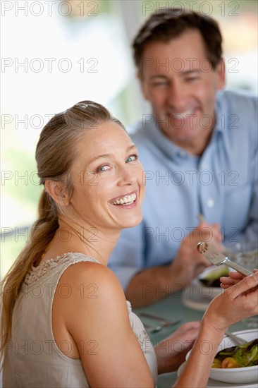 Mature couple eating meal. Photo : Rob Lewine