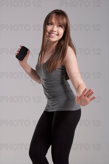 Portrait of young dancing woman, studio shot. Photo: Rob Lewine