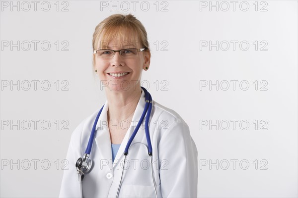 Portrait of female doctor, studio shot. Photo: Rob Lewine