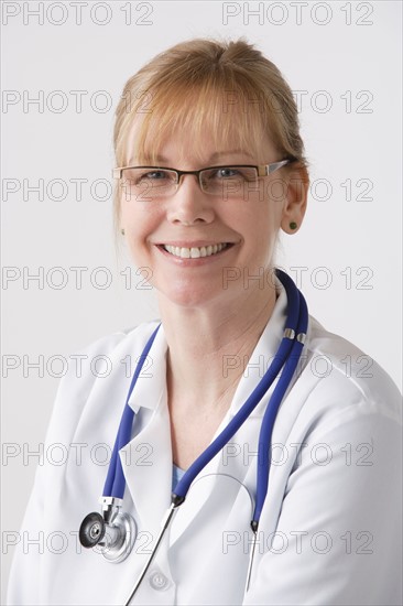 Portrait of female doctor, studio shot. Photo: Rob Lewine