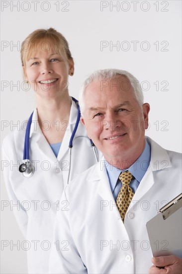 Portrait of female and male doctor, studio shot. Photo : Rob Lewine