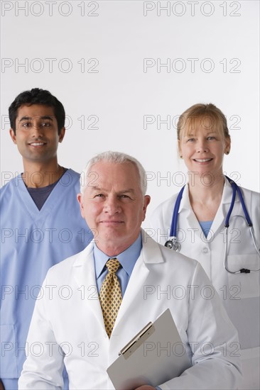 Portrait of three medical professionals, studio shot. Photo: Rob Lewine