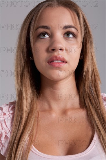 Portrait of teenage girl (16-17), studio shot. Photo: Rob Lewine