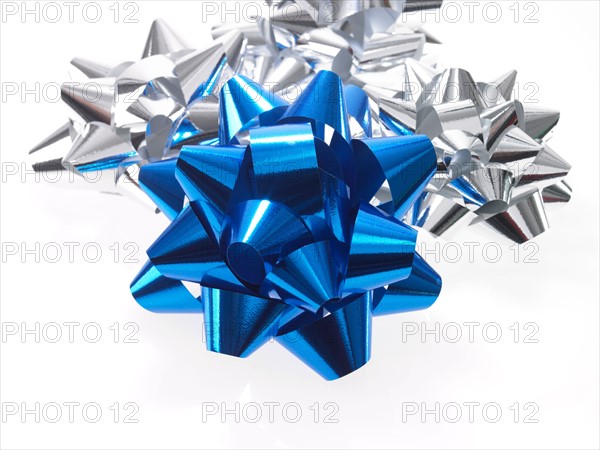 Studio shot of Blue and Silver Ribbon on white background. Photo : David Arky