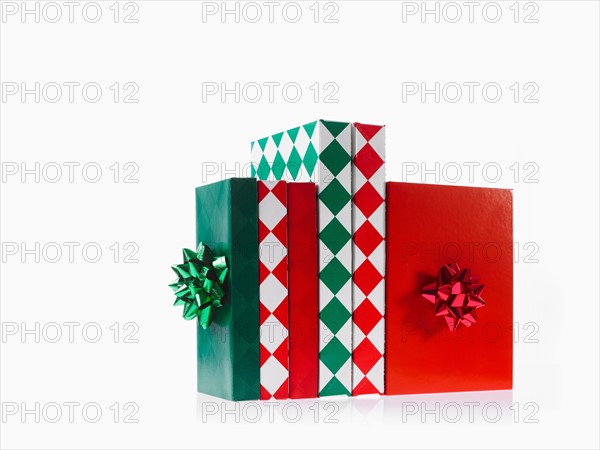 Three boxes with ribbons, studio shot. Photo : David Arky