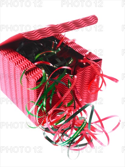 Studio shot of Red and Green Ribbon and Red Box on white background. Photo : David Arky