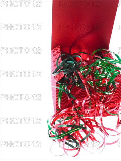 Studio shot of Red Box and Red and Green Ribbon on white background. Photo : David Arky