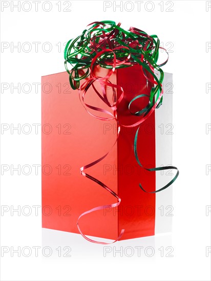 Studio shot of Red Box and Red and Green Ribbon on white background. Photo : David Arky