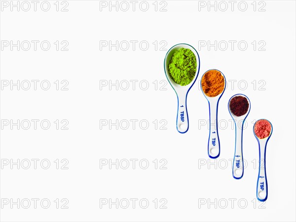 Studio shot of piles of spices on measuring spoons. Photo : David Arky