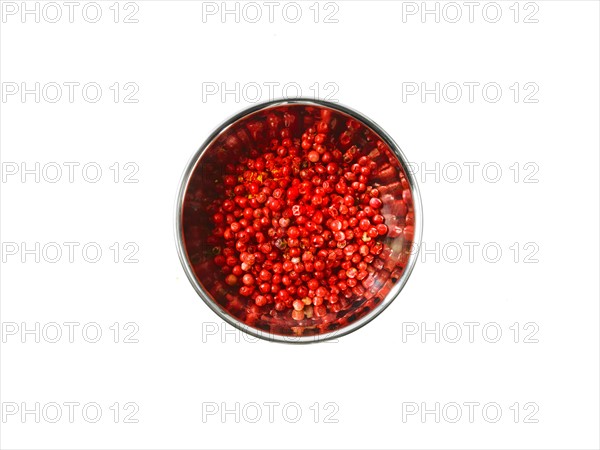 Studio shot of Red Chili Flakes in pan on white background. Photo : David Arky