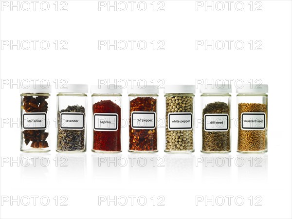 Studio shot of Jars with spices on white background. Photo : David Arky