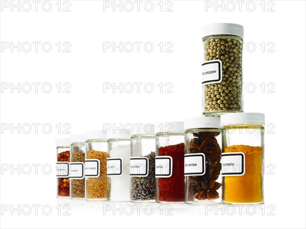 Studio shot of Jars with spices on white background. Photo : David Arky