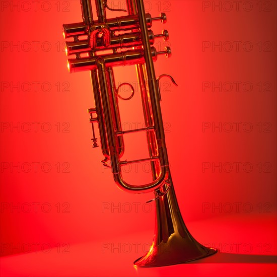 Close up of trumpet on red background. Photo: Daniel Grill