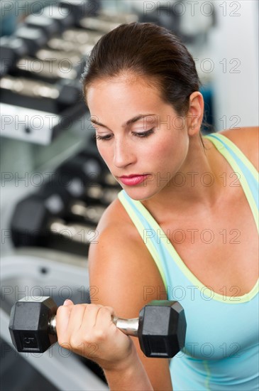 Woman exercising with dumbbells.