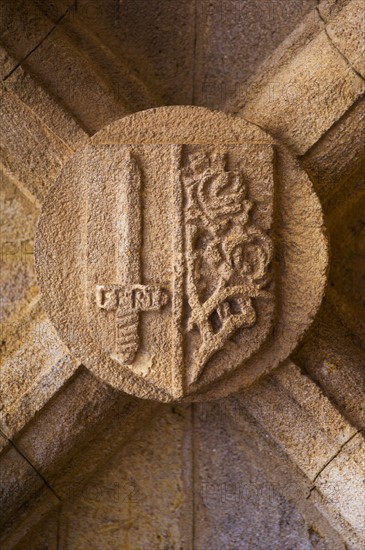 Greece, Rhodes, Stone shield on medieval fortified wall.