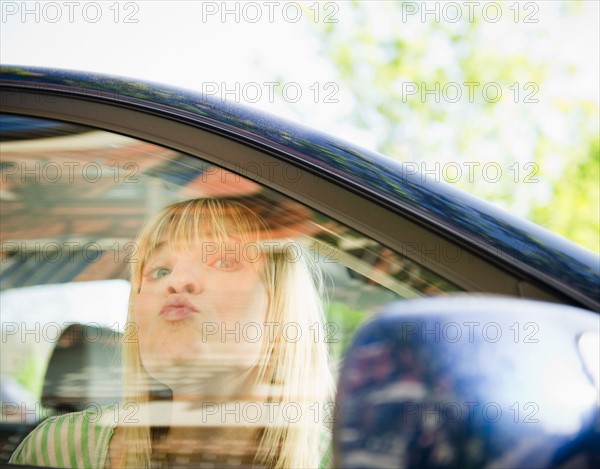 USA, New York, Williamsburg, Brooklyn, Portrait of woman in car. Photo : Jamie Grill