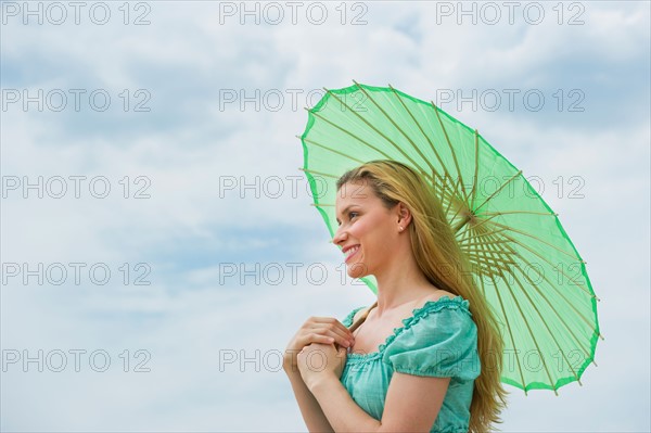Woman holding parasol.