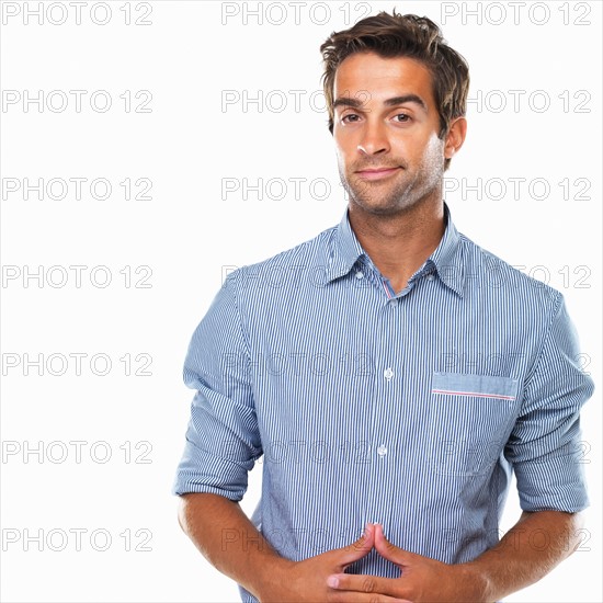 Studio portrait of business man smirking. Photo : momentimages