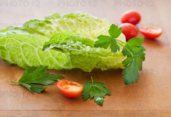 Fresh salad on cutting board.