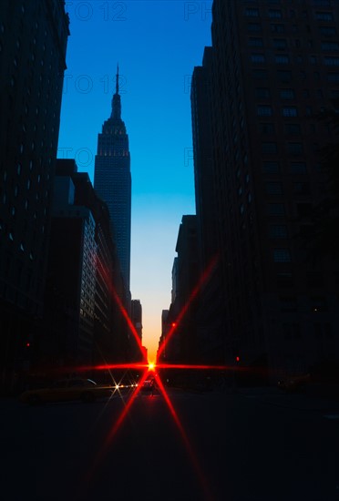 USA, New York, New York City, Silhouette of Empire State Building and street.