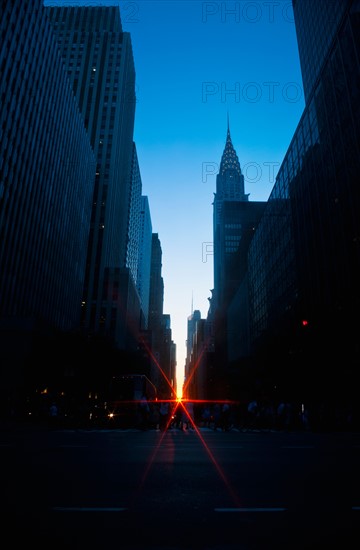 USA, New York, New York City, Chrysler Building and street at sunset.