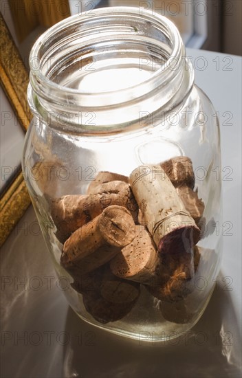 Wine corks in glass jar.