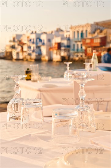 Greece, Cyclades Islands, Mykonos, Set tables by sea.