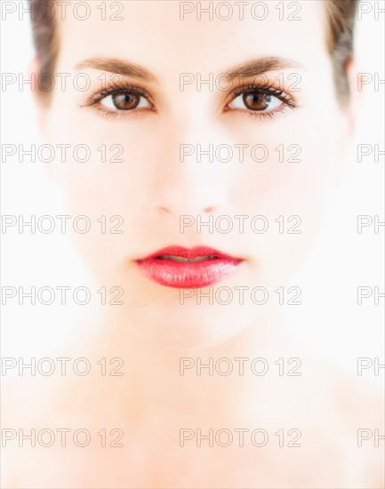 Studio portrait of young woman.