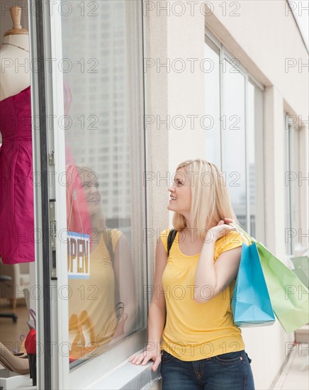 Young woman in front of boutique. Photo: Jamie Grill