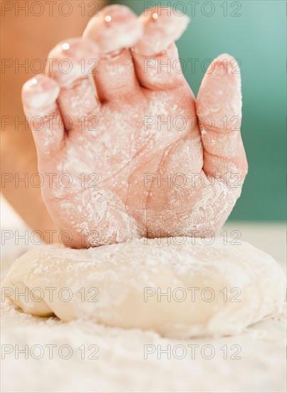 Close up of woman's hand preparing dough. Photo: Jamie Grill