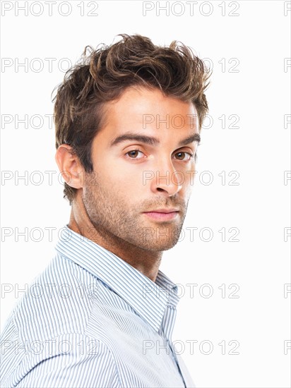 Close- up portrait of successful business man. Photo: momentimages