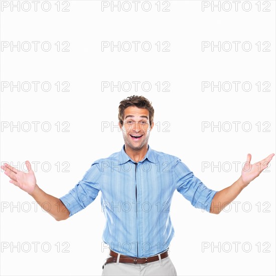 Portrait of happy business man standing. Photo: momentimages