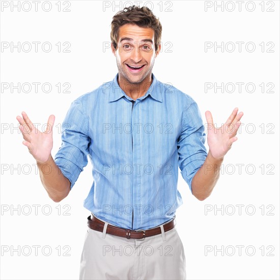 Portrait of excited business man standing. Photo: momentimages