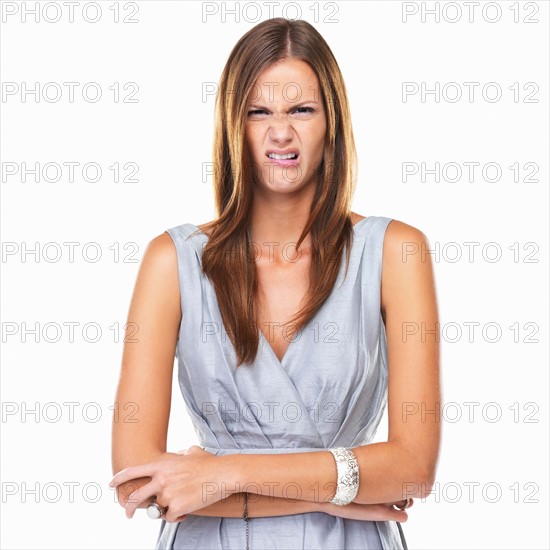 Studio portrait of elegant woman with disgusted expression. Photo: momentimages