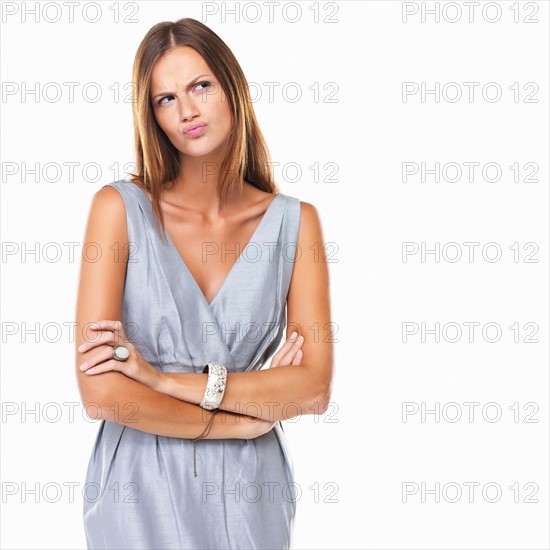 Studio portrait of elegant woman with pursed lips. Photo: momentimages