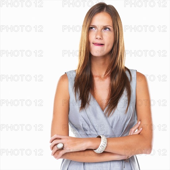 Studio portrait of young elegant woman licking lips. Photo : momentimages