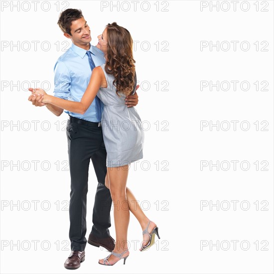 Studio shot of man and woman dancing. Photo : momentimages