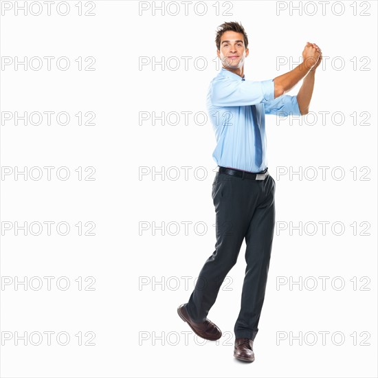 Studio shot of business man celebrating success. Photo: momentimages